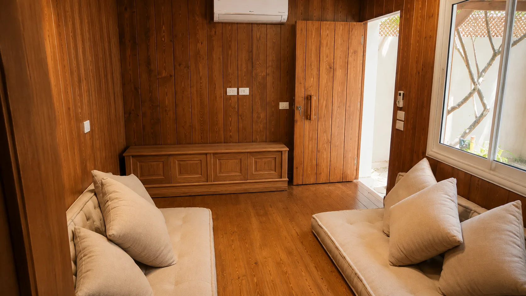 Wood-panelled villa sitting room in the Maadi Villa project in Maadi