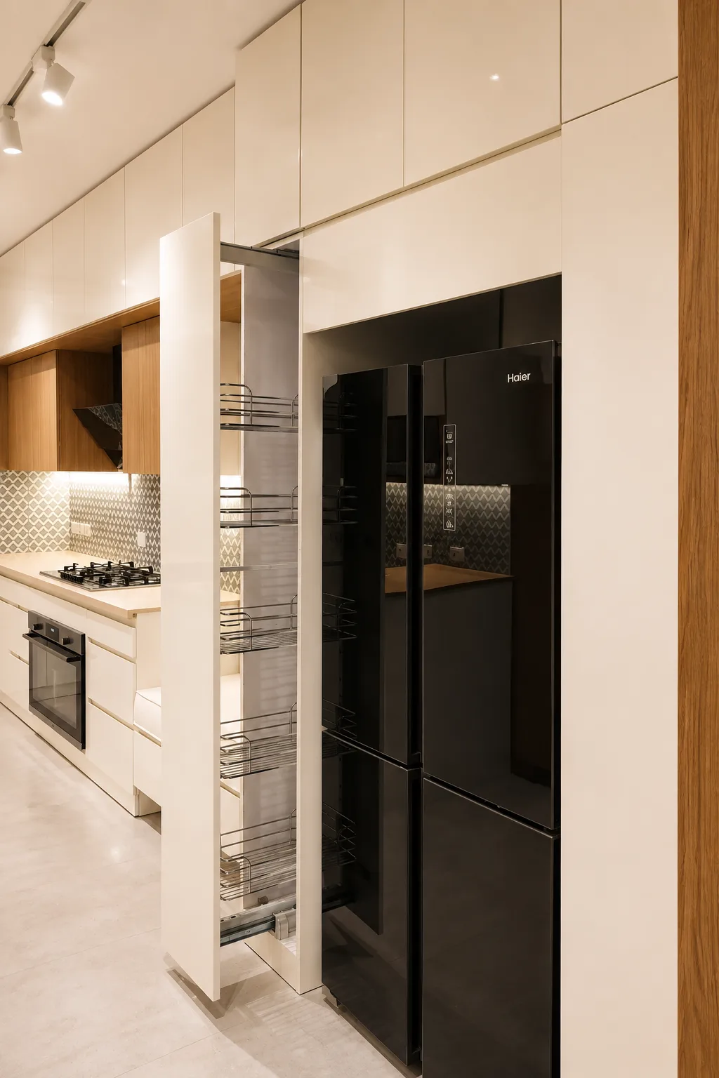 White kitchen with black refrigerator in the Maadi Villa project in Maadi